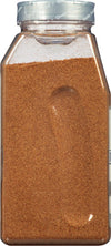 A clear plastic jar filled with ground cinnamon.