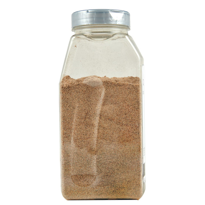 A glass jar with a silver lid filled with brown spices.