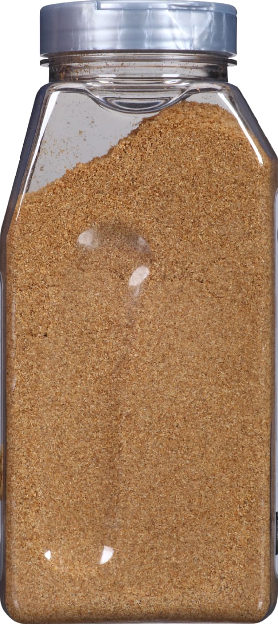 A plastic jar filled with a brown powder.