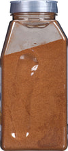 A glass jar filled with ground cinnamon.