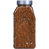 A clear plastic jar filled with coriander seeds.