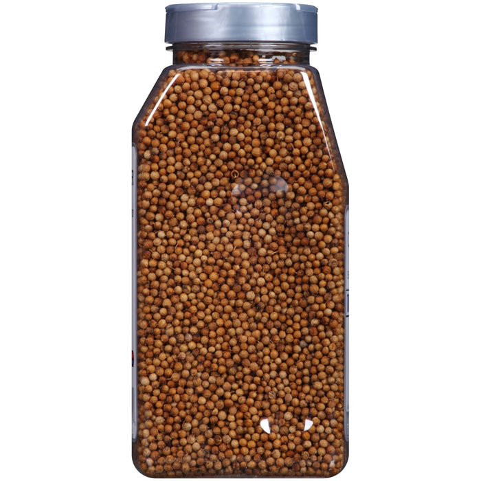 A clear plastic jar filled with coriander seeds.