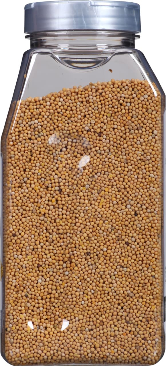 A clear plastic jar filled with yellow mustard seeds.