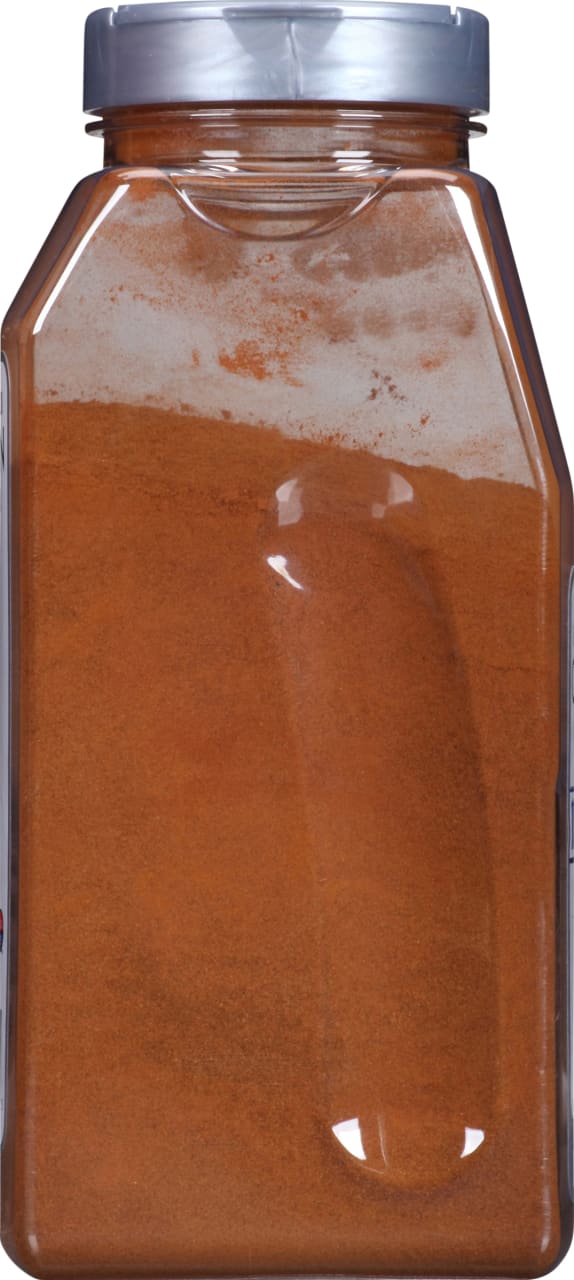 A clear plastic jar filled with a brown powder.