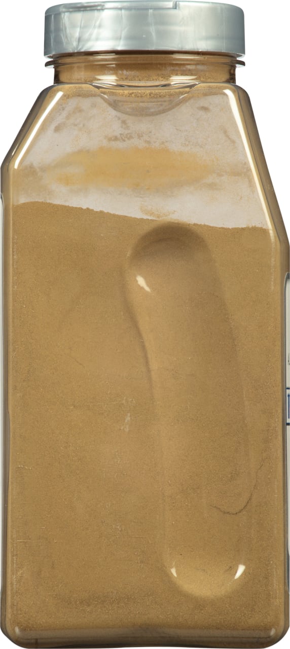 A plastic jar filled with brown powder.