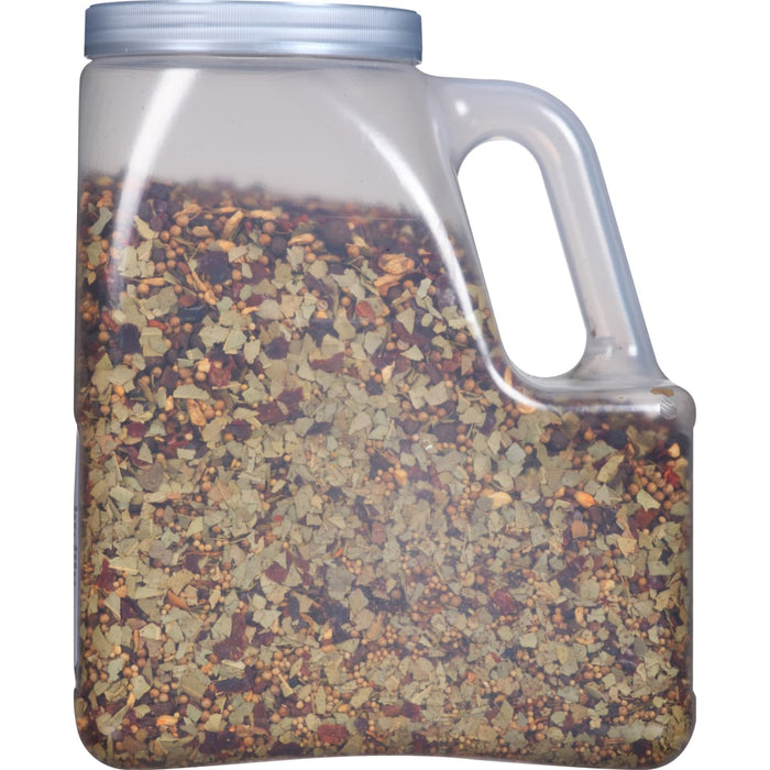 A clear plastic jar filled with a blend of herbs and spices.