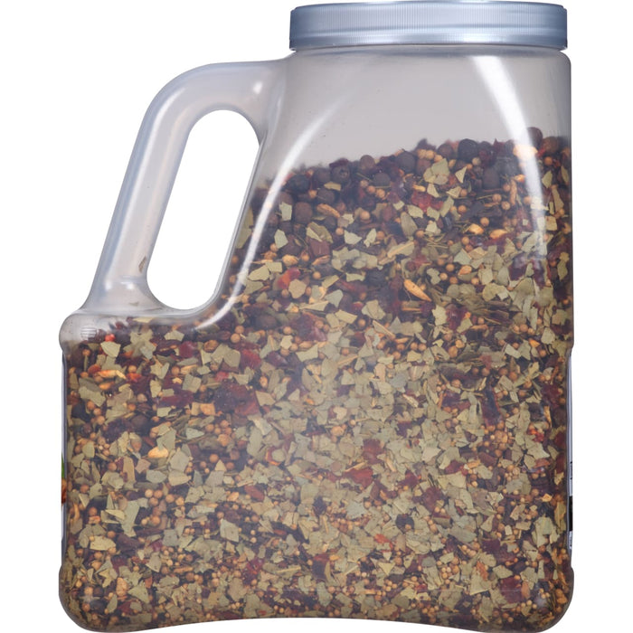 A clear plastic jar filled with a blend of spices.