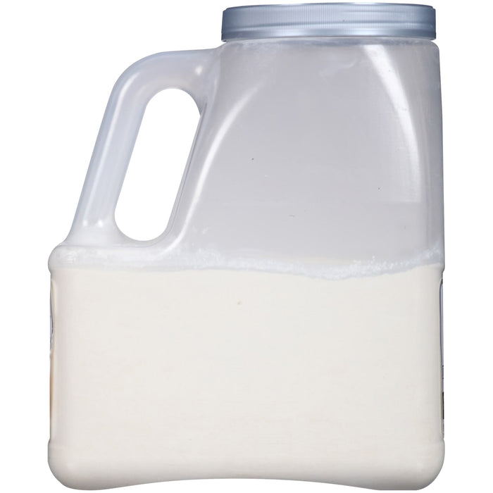 A white plastic jug filled with a white substance.
