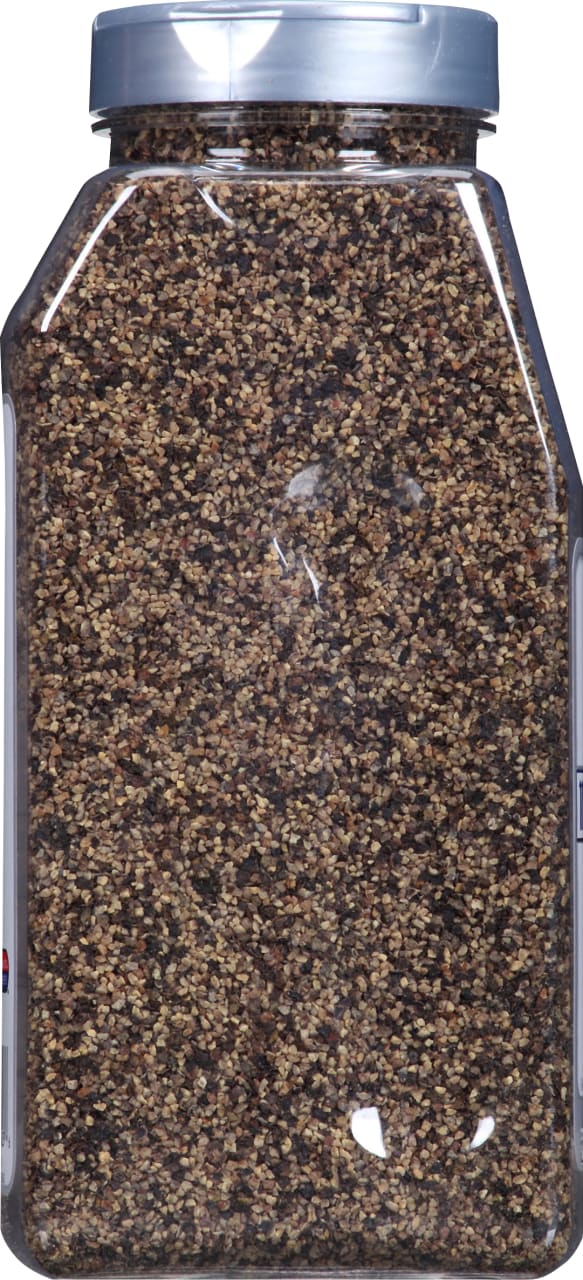 A clear plastic container filled with black peppercorns.