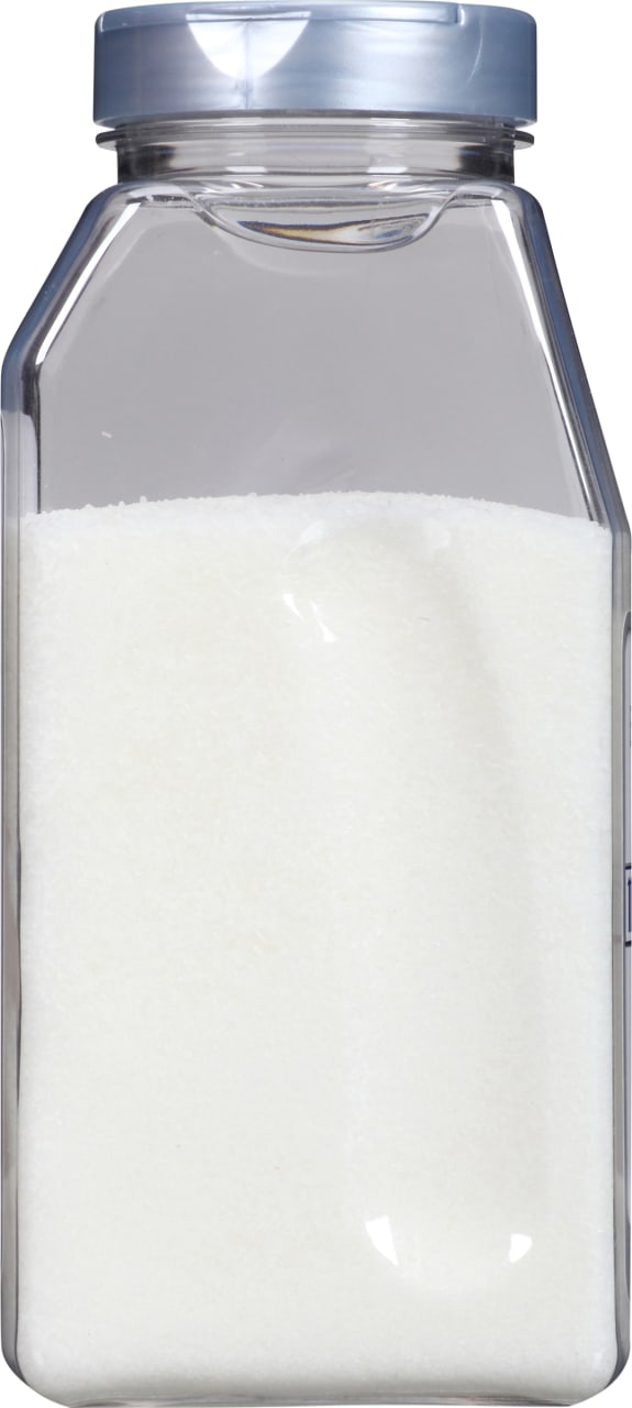 A glass jar filled with white sugar.