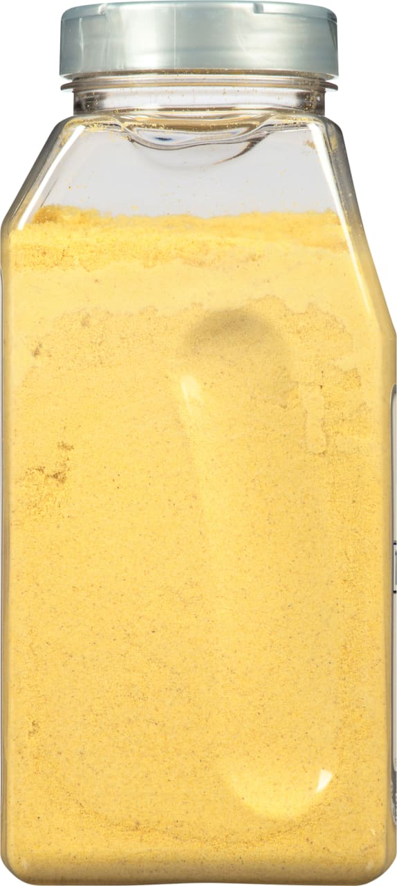A clear plastic jar filled with yellow mustard powder.