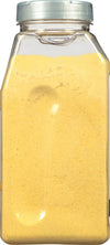 A clear plastic jar filled with yellow mustard powder.