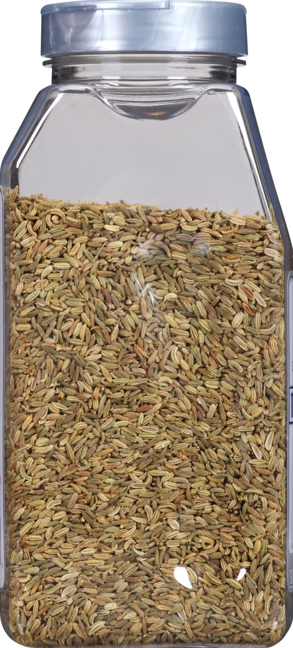 A glass jar filled with fennel seeds.