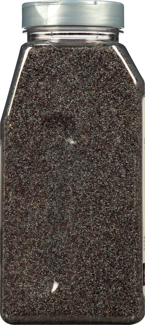 A plastic container filled with poppy seeds.