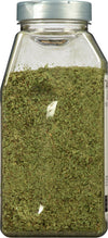 A glass jar filled with dried tarragon.