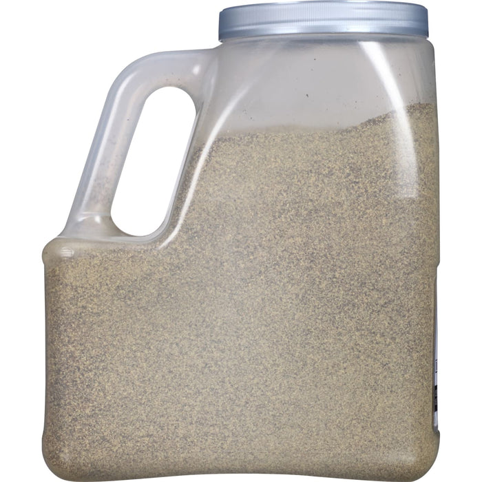 A plastic container filled with ground black pepper.