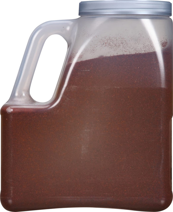 A plastic container filled with red chili powder.