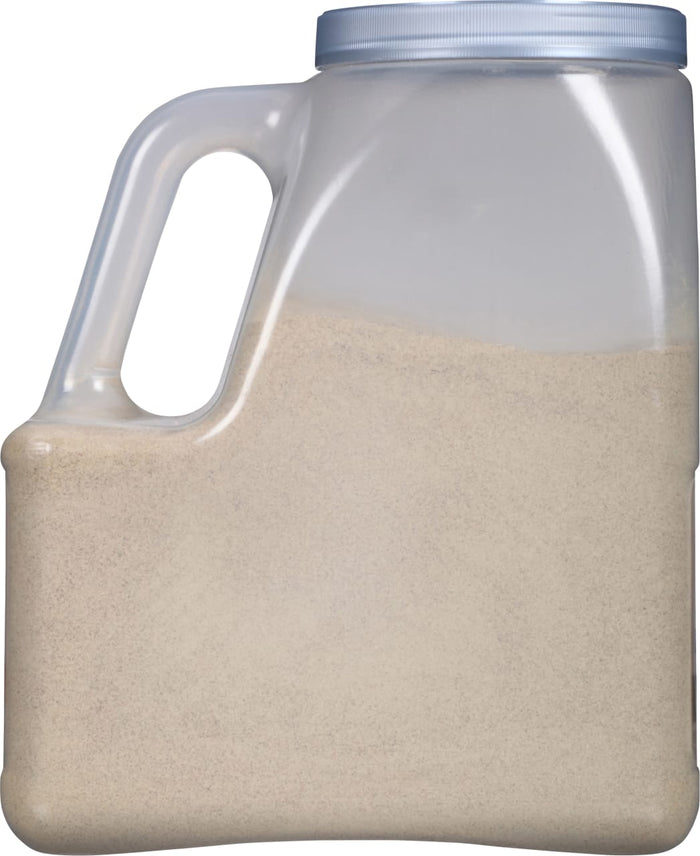 A clear plastic container filled with a beige powder.