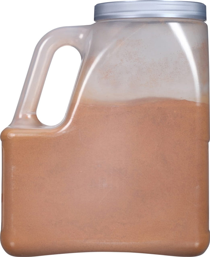 A clear plastic container filled with a brown powder.
