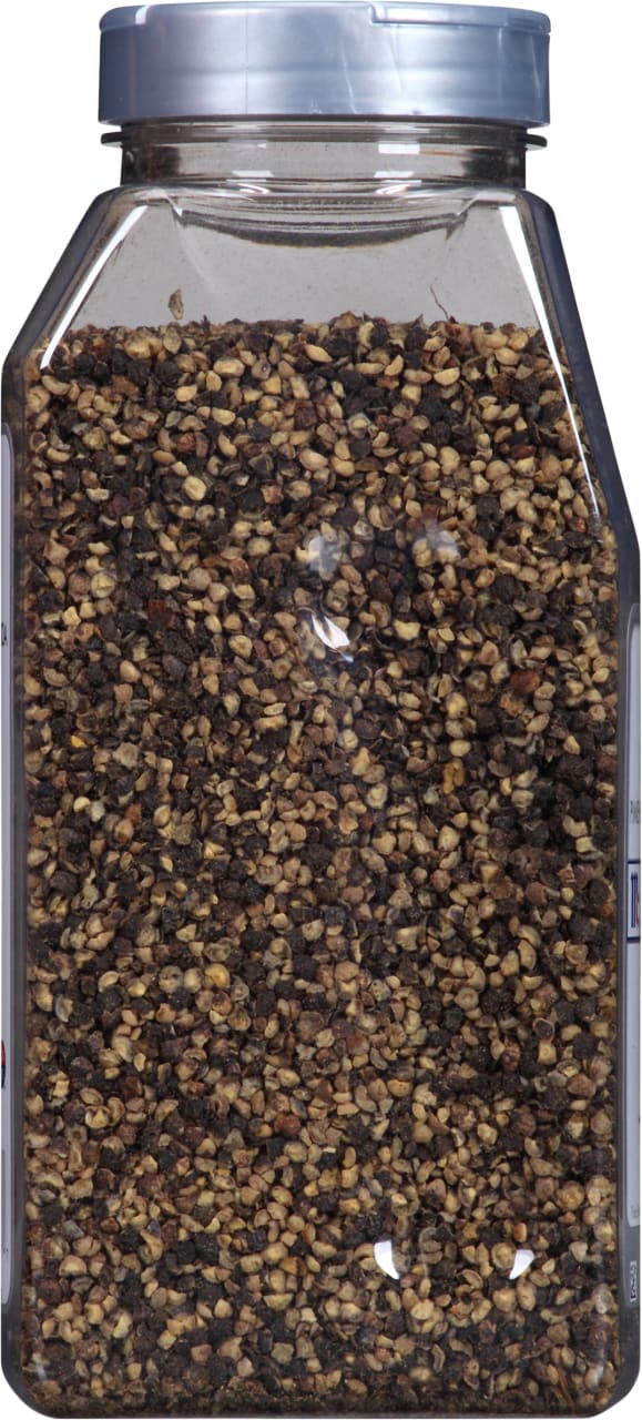 A clear plastic jar filled with black peppercorns.