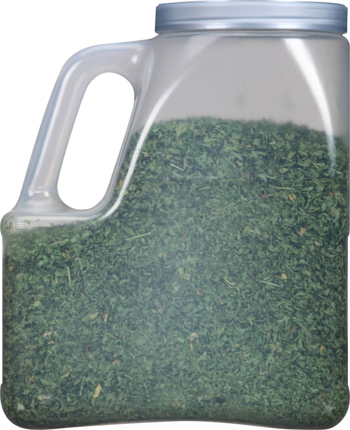 A clear plastic container filled with dried parsley.