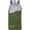A glass jar filled with dried parsley.