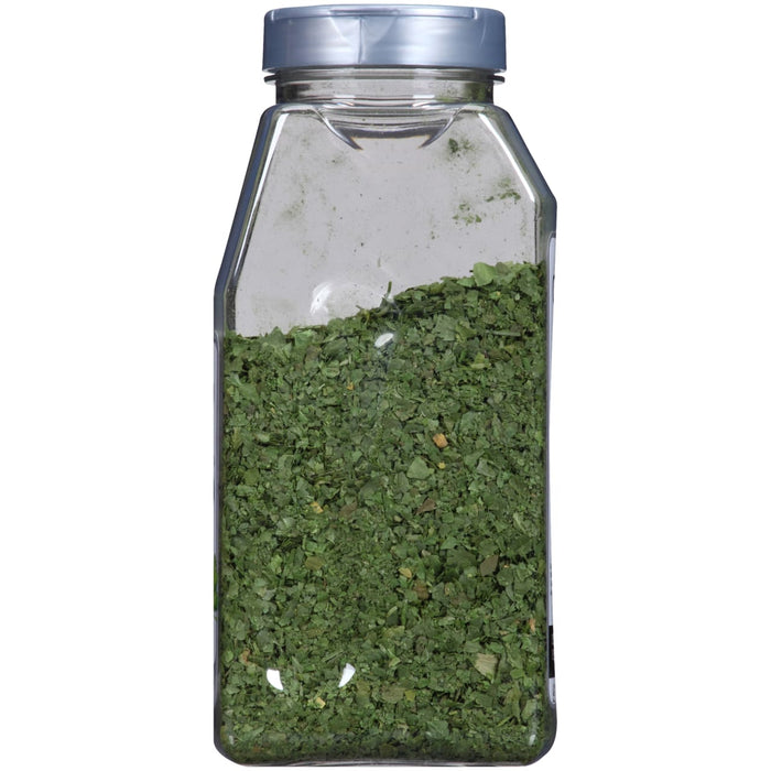 A glass jar filled with dried parsley.
