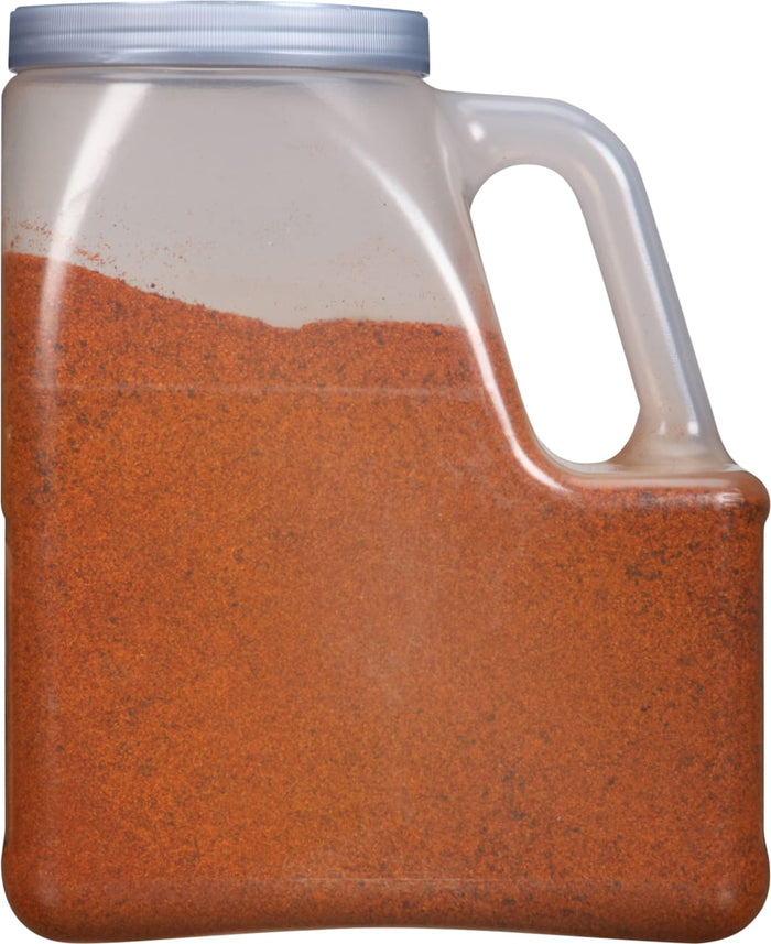 A plastic container filled with a red powder.