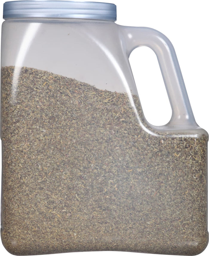 A clear plastic jar with a handle filled with dried herbs.