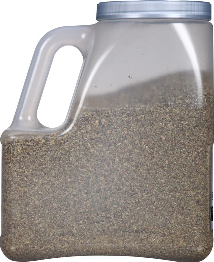 A clear plastic container filled with dried herbs.