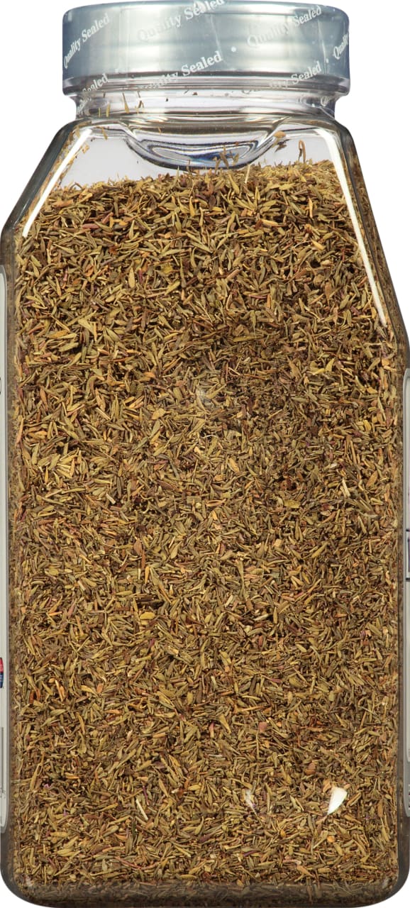 A glass jar filled with dried thyme.