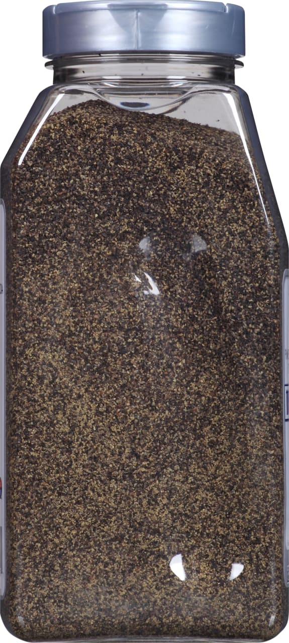 A clear plastic container filled with black peppercorns.