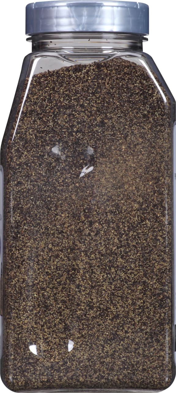 A clear plastic jar filled with black peppercorns.