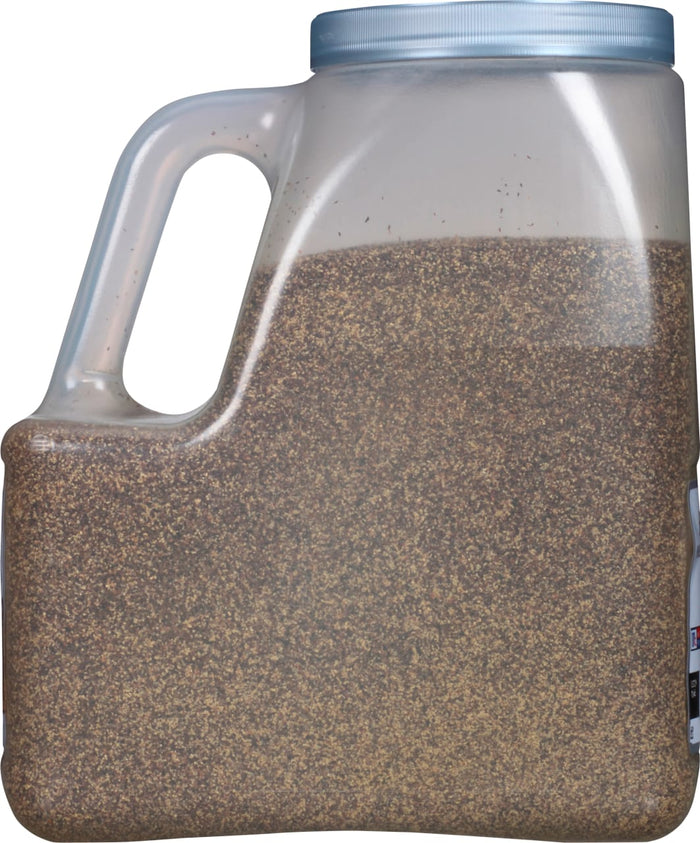 A plastic container filled with black peppercorns.