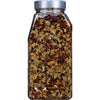 A glass jar filled with a blend of spices and herbs.