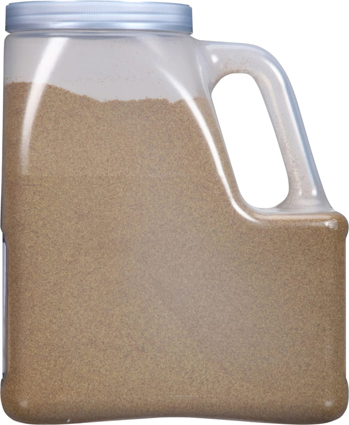 A clear plastic container filled with brown granules.