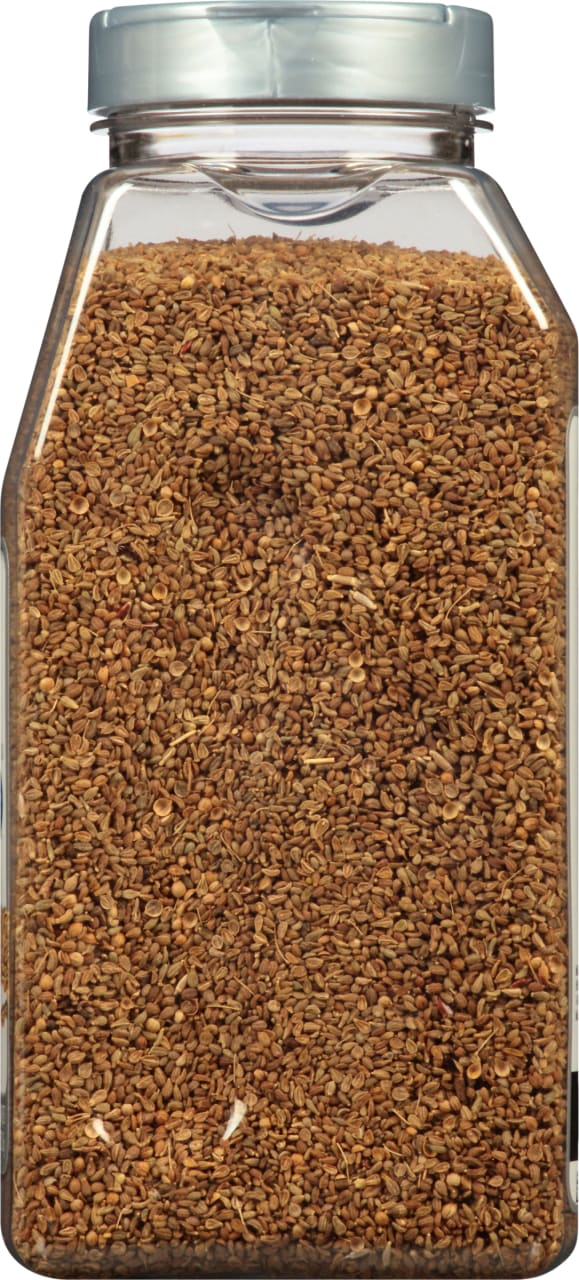 A close-up of a jar filled with coriander seeds.