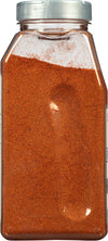 A clear plastic jar filled with a red spice.