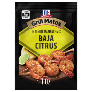 A packet of McCormick Grill Mates Baja Citrus marinade mix is displayed, showcasing seasoned shrimp and citrus fruits.