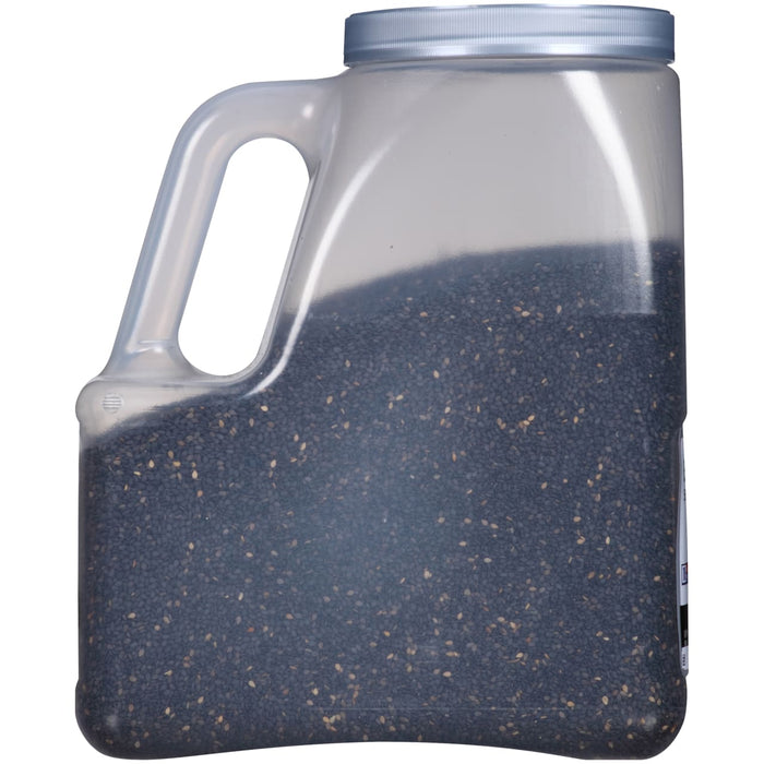 A clear plastic container filled with black sesame seeds.
