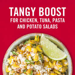 A bowl of corn salad with a lime wedge on top with the text Tangy Boost for Chicken Tuna Pasta and Potato Salads above it.