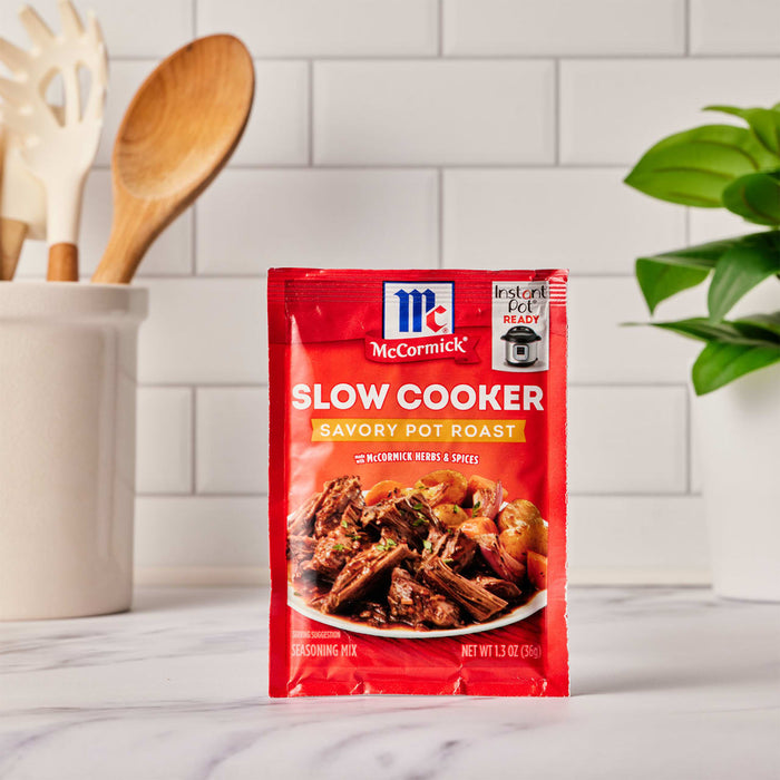 McCormick Slow Cooker Savory Pot Roast seasoning mix package with a picture of a pot roast on the front.