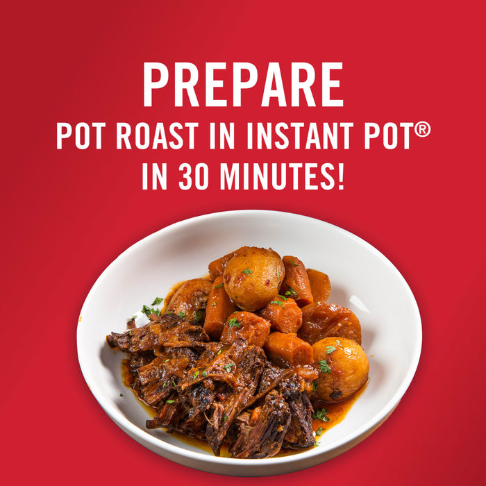 A plate of Instant Pot pot roast with potatoes and carrots.