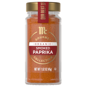 A jar of McCormick Gourmet Organic Smoked Paprika Collection is displayed, showcasing its vibrant color and branding.