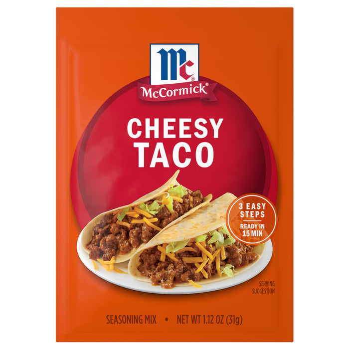 McCormick Cheesy Taco Seasoning Mix package with a serving suggestion of two tacos on a white plate.