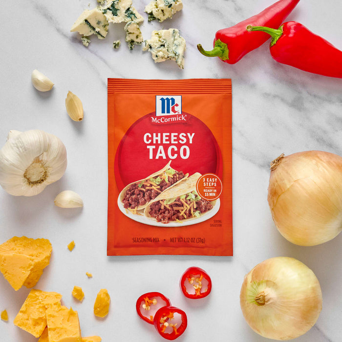 McCormick Cheesy Taco seasoning packet is displayed with ingredients like cheese, garlic, onion, and peppers.