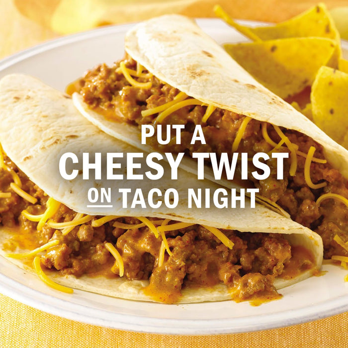 Two cheesy tacos are displayed with tortilla chips, suggesting a fun and flavorful twist on taco night.