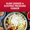 A slow cooker or electric pressure cooker is filled with chopped vegetables, suggesting a recipe or cooking method.