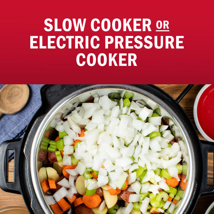 A slow cooker or electric pressure cooker is filled with chopped vegetables, suggesting a recipe or cooking method.