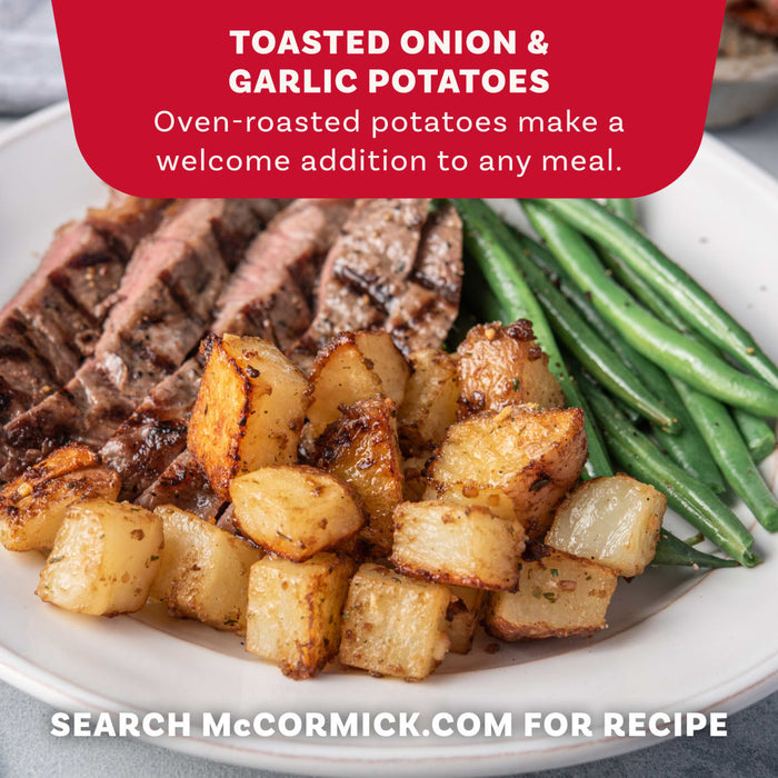 A close-up of a plated meal shows toasted onion and garlic potatoes, made with Mccormick Toasted Onion And Garlic Seasoning Mix 1.25 Oz, served alongside sliced steak and green beans.